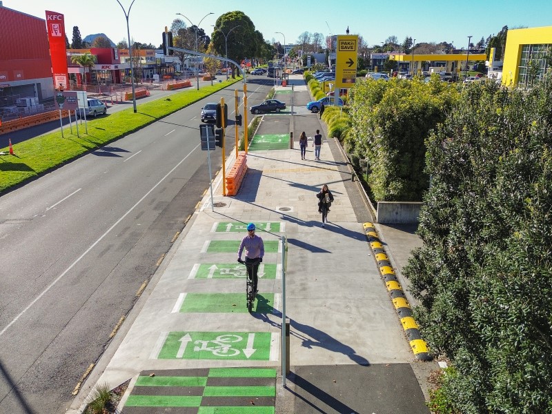 An example of a shared use area, with signalised pedestrian crossing.